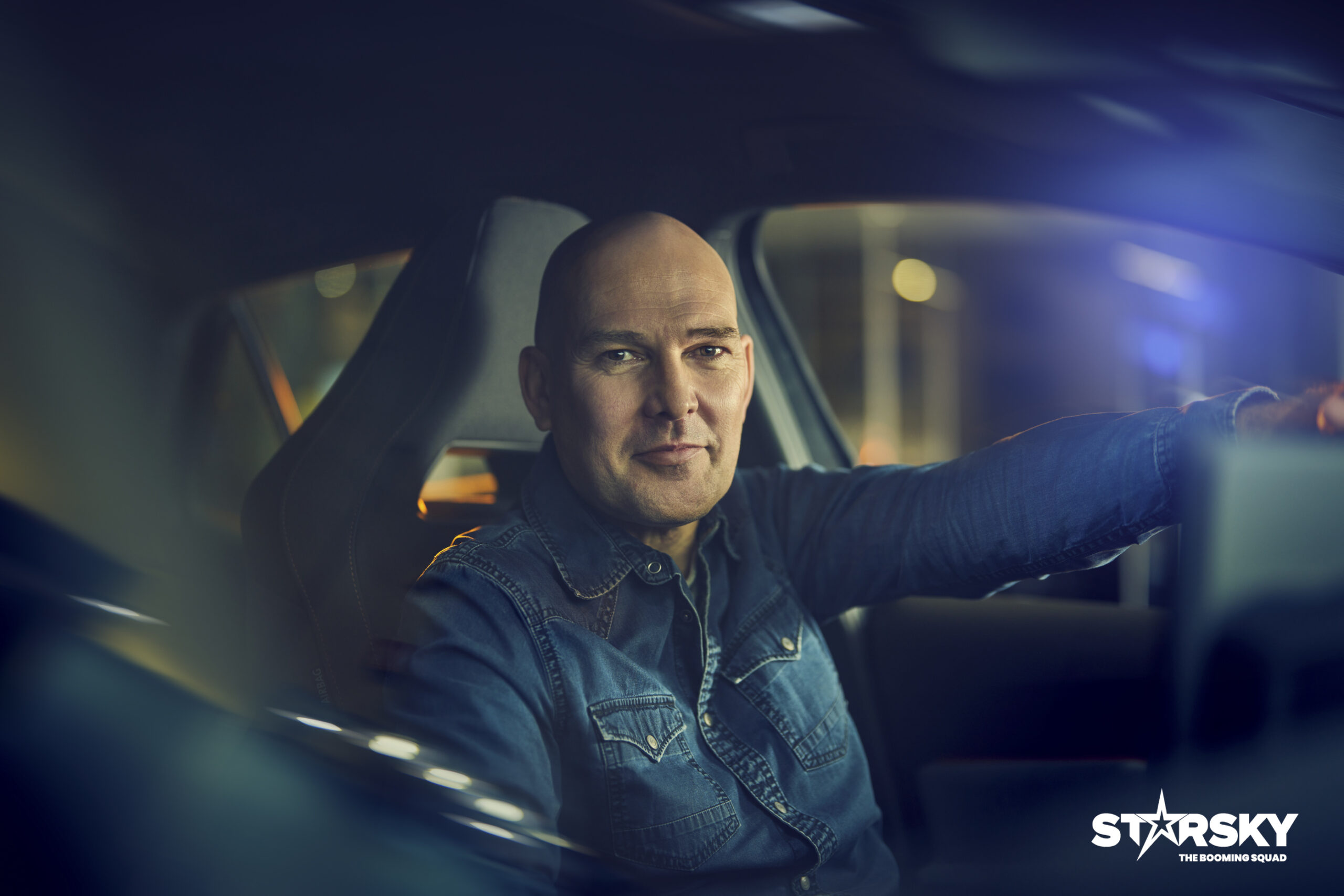 Kristiaan Cloots, founder and CEO of STARSKY, seated in a car. Supplied original colour photograph.